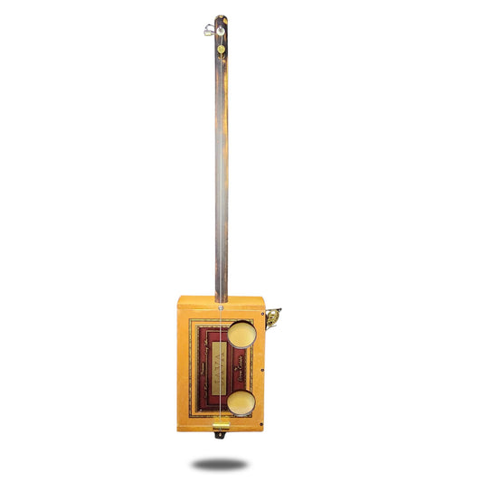 Single string cigar box banjo with custom sound holes and 44 magnum bridges